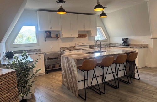 DeLand House | Deland Dome Home- 98" TV - Open Kitchen