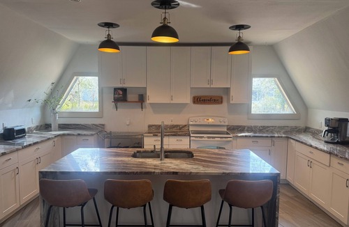 DeLand House | Deland Dome Home- 98" TV - Open Kitchen