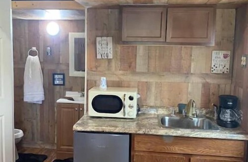 Smith County House | Delightful kitchenette style tiny home with loft.