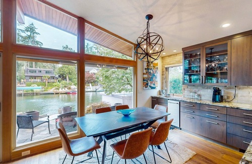 Blue Heron House | Delightful Retreat with Water Views, Fast WiFi, Gas Grill, & Furnished Patio