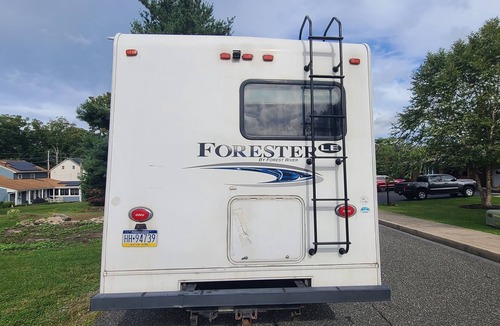 Emmaus House | Delightful RV rental with AC and kitchenette