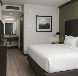 Wheatland Hotel | DELSOL Hotel Suites OKC Airport, Event Center, indoor Pool and Kids Arcade, 5 Min from Paycom, Fairgrounds
