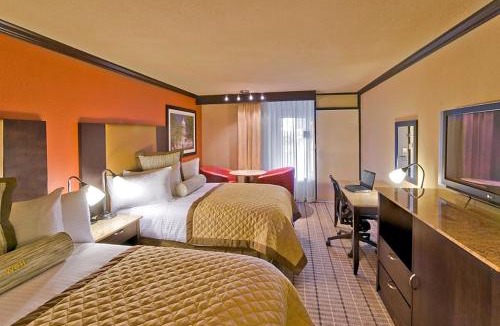 Wheatland Hotel | DELSOL Hotel Suites OKC Airport, Event Center, indoor Pool and Kids Arcade, 5 Min from Paycom, Fairgrounds