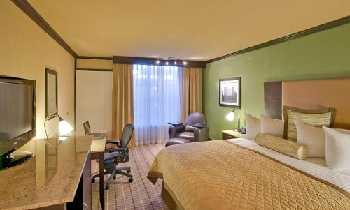 Wheatland Hotel | DELSOL Hotel Suites OKC Airport, Event Center, indoor Pool and Kids Arcade, 5 Min from Paycom, Fairgrounds