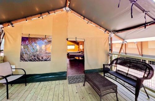 Sutherland Springs House | Deluxe Safari Tent Cabin with Creek Swimming, Fishing & Resort-Style Amenities in Marion, Texas