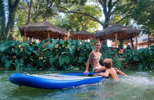 Sutherland Springs House | Deluxe Safari Tent Cabin with Creek Swimming, Fishing & Resort-Style Amenities in Marion, Texas
