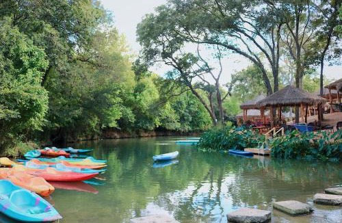 Sutherland Springs House | Deluxe Safari Tent Cabin with Creek Swimming, Fishing & Resort-Style Amenities in Marion, Texas