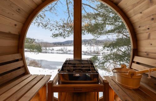 Johnson House | Designer A-Frame Treehouse with hot tub on river