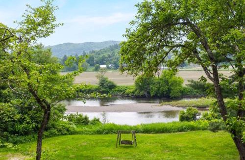 Johnson House | Designer A-Frame Treehouse with hot tub on river