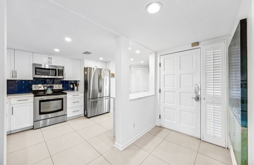Fernandina Beach Condo | Designer aesthetic with calming sea-foam palette.