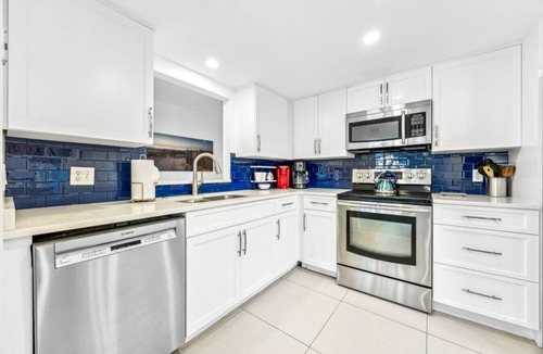 Fernandina Beach Condo | Designer aesthetic with calming sea-foam palette.