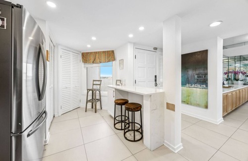 Fernandina Beach Condo | Designer aesthetic with calming sea-foam palette.