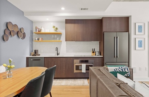 Rainey Street Historic District Condo | Designer Condo Steps to Lady Bird Lake with gym & rooftop pool