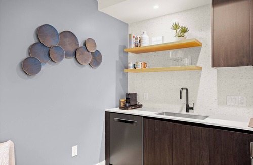 Rainey Street Historic District Condo | Designer Condo Steps to Lady Bird Lake with gym & rooftop pool