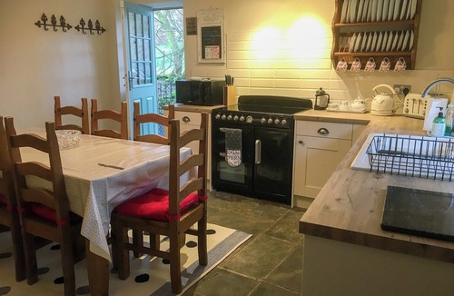 Kettlewell Cottage | Detached barn conversion with side terrace overlooking the river.