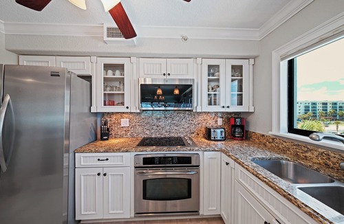 New Smyrna Beach Condo | Direct oceanfront corner 3/2 with a large wrap around balcony and heated pool