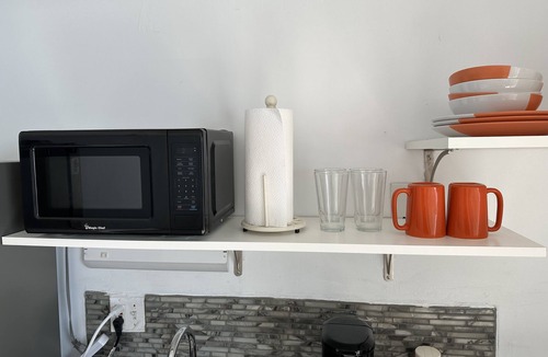 Bostwick Park Apartment | Direct Oceanfront Studio with Balcony, King Bed, Kitchenette, and Wifi