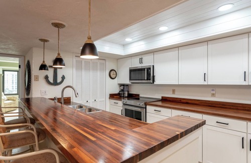 Ormond-by-the-Sea Condo | Direct oceanfront corner condo with big balcony, heated beachfront pool and garage parking