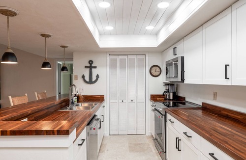 Ormond-by-the-Sea Condo | Direct oceanfront corner condo with big balcony, heated beachfront pool and garage parking