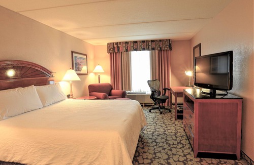 Chinatown Hotel | Discover Modern Comfort at Accommodating Houston Room with Outdoor Pool and Tub