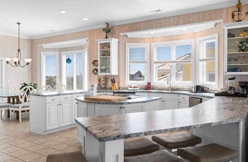 Caswell Beach House | Discover Peace on the Beach, a stunning 6BR, 5BA oceanfront retreat in Oak Island.