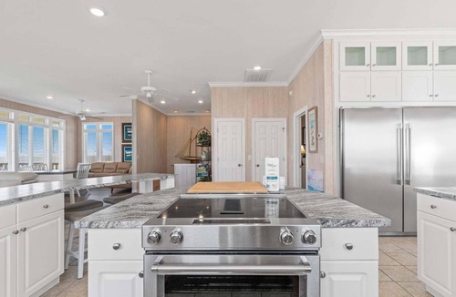 Caswell Beach House | Discover Peace on the Beach, a stunning 6BR, 5BA oceanfront retreat in Oak Island.