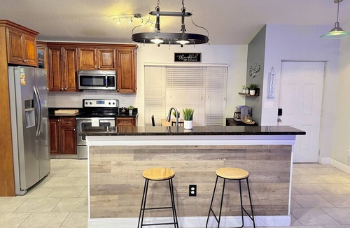 Windwood Bay House | Disney Getaway Oasis with Nature, Fire Pit & BBQ. Family-Friendly Retreat