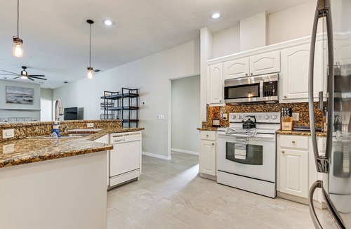 Land O' Lakes House | Dock, Lanai & Pool! Modern Red Bug Lake Retreat