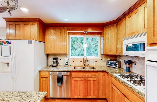 Maple Heights-Lake Desire House | Dog-friendly home with large yard, inviting deck & spacious layout
