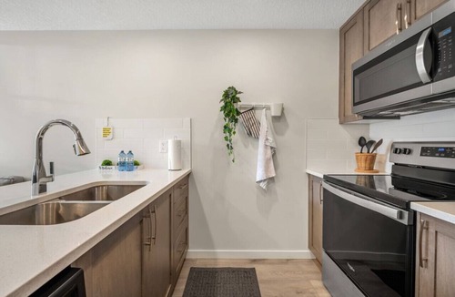 Northwest Calgary Villa | Dog Friendly » King Bed » Free Banff Pass » AC