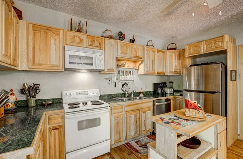 Wiley Cabin | Dog-friendly riverfront cabin w/waterfall view, large decks, firepit, Ping-Pong