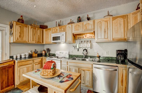 Wiley Cabin | Dog-friendly riverfront cabin w/waterfall view, large decks, firepit, Ping-Pong