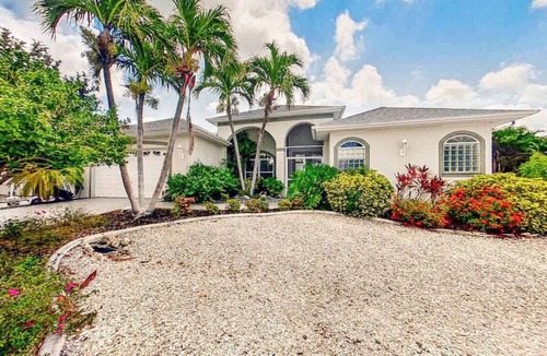 Matlacha Isles House | Dog-friendly waterfront home with heated pool, lanai, central AC, & W/D