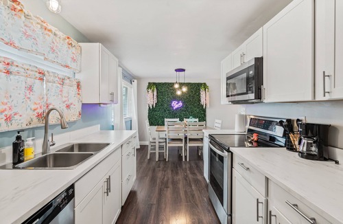 Huber Heights House | Dolly's Haven: 4BR, 2BA, Game-room, covered deck with fire-pit