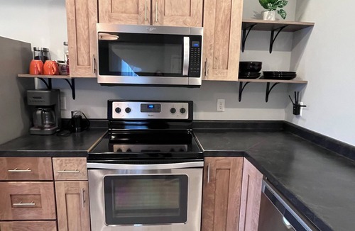 Dubuque Apartment | Downtown Dubuque Retreat, Spa Access, Private Deck, One block to Farmers Market,
