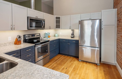 Central Business District Apartment | Downtown Luxury Loft, 13-Ft Ceilings, Walkable