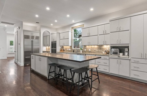 Bouldin House | Downtown, sleeps 24, 2 pools, spas, game room, gym