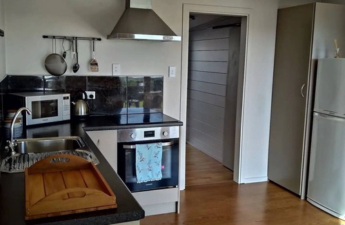 Koitiata House | Drift Inn Romantic seafront entire beach house.