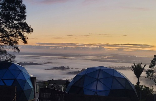 Waiatarua Cabin | DuskDawn Glass dome glamping in the bush near AucklandnNOW with a Spa!