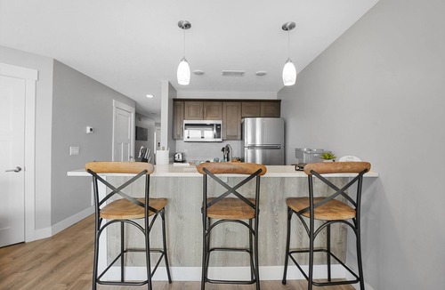 Traverse City Condo | East Bay Bliss - Beachfront Condo on East Grand Traverse Bay