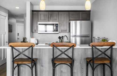 Traverse City Condo | East Bay Bliss - Beachfront Condo on East Grand Traverse Bay