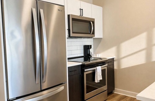 Lower East Side Apartment | East Side Luxury 1BR Apt · Near Brady St with Balcony and Lounge · Sleeps 4