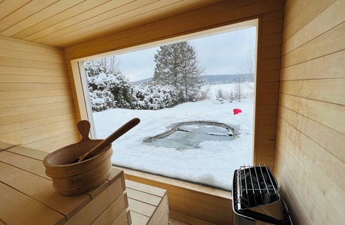 Eastman Cottage | Eastern Townships waterfront with salt-in-ground spa, sauna, pool table and wifi