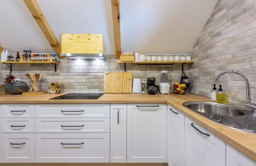 Gospic House | Eco-friendly mountain retreat with pool, jacuzzi, sauna, and panoramic Velebit views.