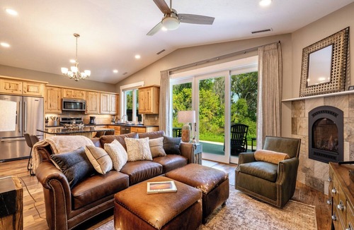 Sheridan Condo | Elegant 2BD, 2BA creekside retreat in Powderhorn Golf Community. This private guest suite comfortably fits 4 & features a cozy fireplace, beautiful kitchen & expansive patio w/a BBQ overlooking Goose Creek. Perfect for a quiet getaway.