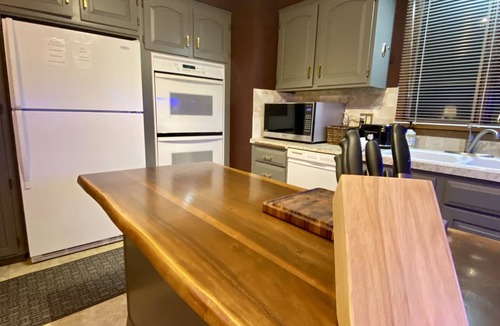 Fort Morgan House | Elegant Three Bedroom Home with Patio and Fireplace