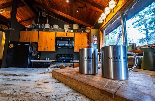 Sundance Cabin | Elevated creekside escape Set in the trees Hot tub Private setting Above Sundance Canyon