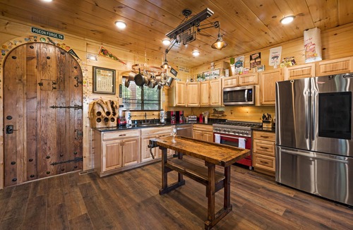 Sevierville Cabin | Elevator! Indoor Pool, 2 Arcades, Outdoor Kitchen and Firepit 8per Hot Tub