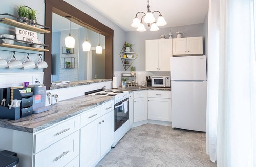 Oswego Apartment | Elysian Loft – Where Serenity Meets Style, Your Tranquil Retreat Above the Spa