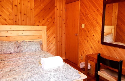 Cayamant Cottage | Enchanted Forest Retreat, King Bed Suite with Spa.